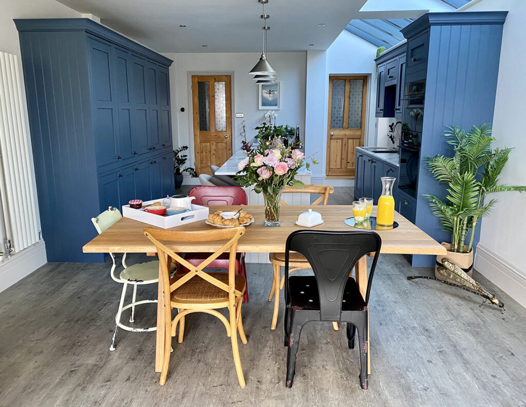 View of dining table and kitchen in kitchen makeover