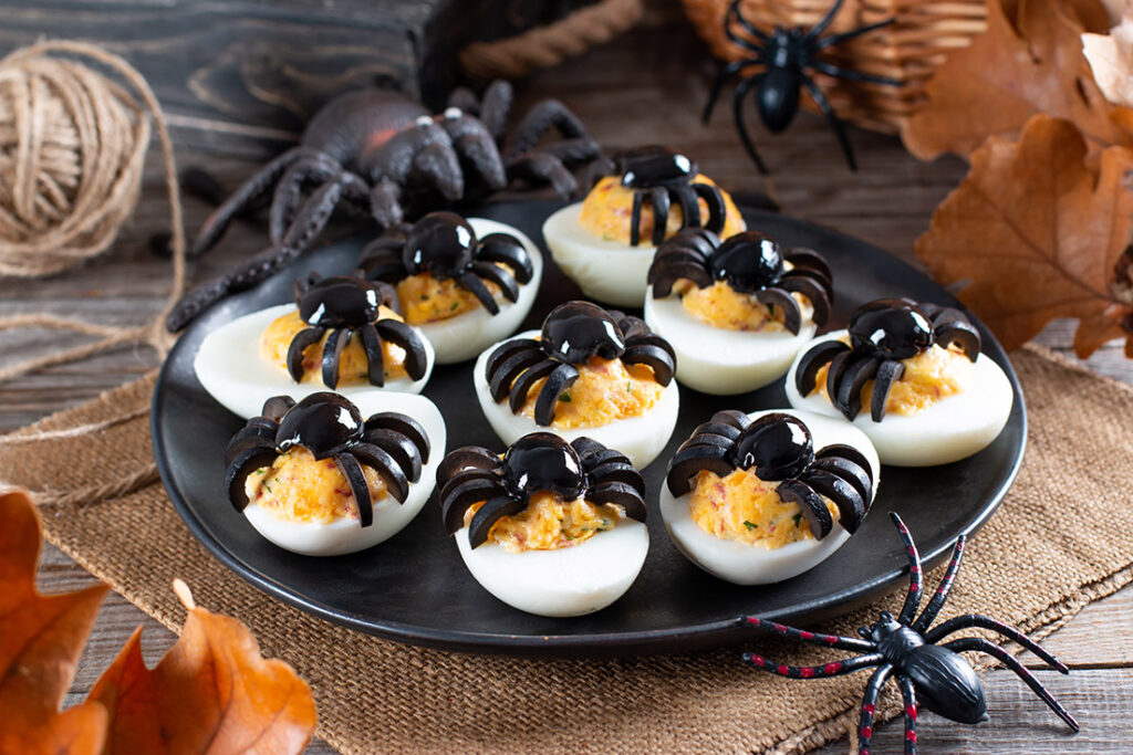 Devilled eggs with olive spiders Halloween party food