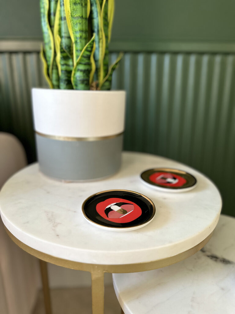 Marble topped tables with brass legs