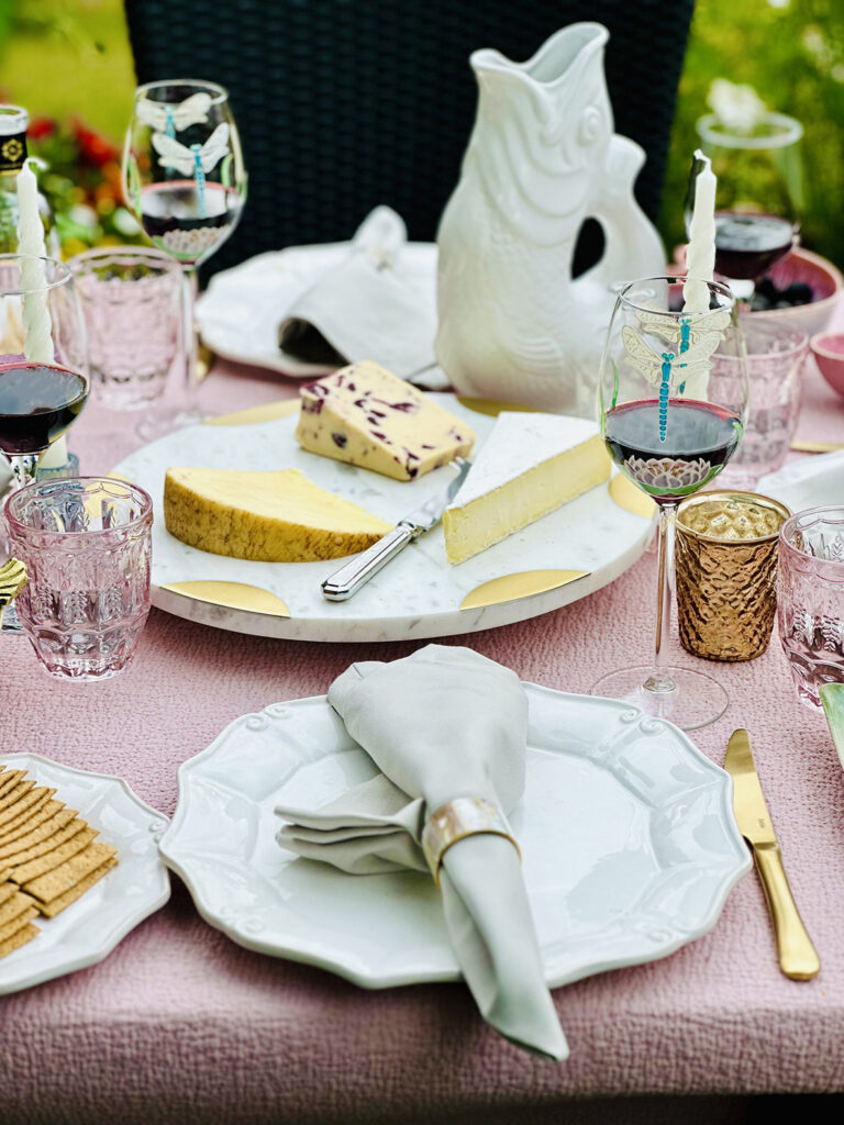 Gold accents on outdoor dining table design by Emma Green interior designer