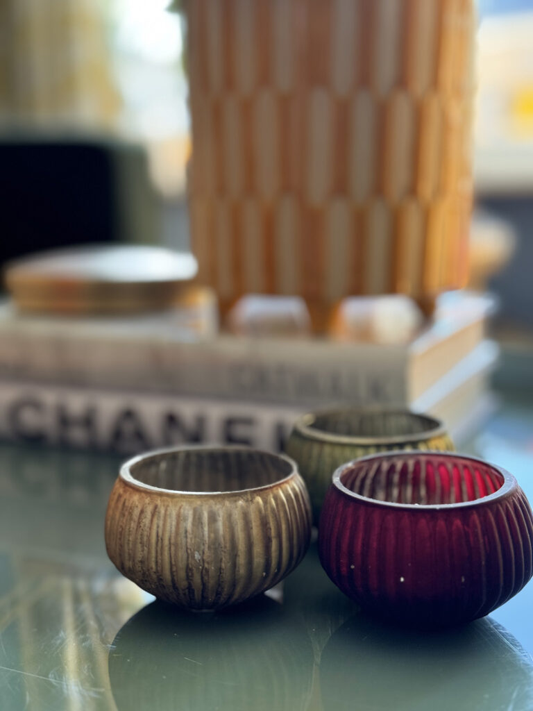 Tea lights adding interest to a coffee table display in Sarah's home