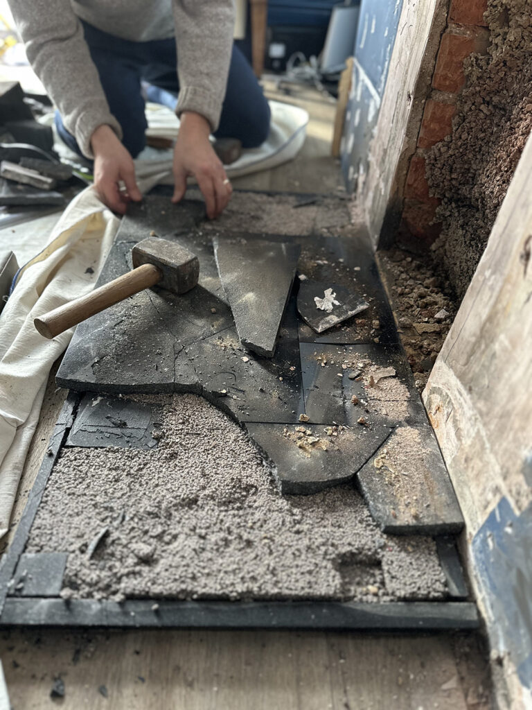 Knocking out granite to make way for tiling