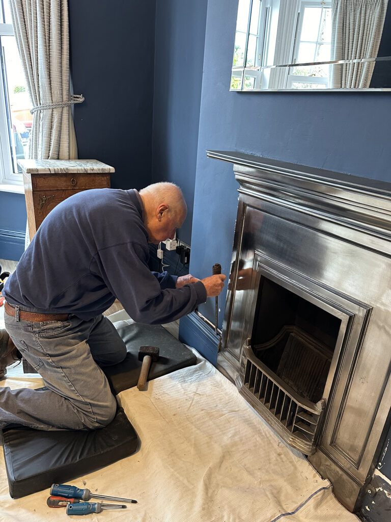 My father removing the skirting and fireplace